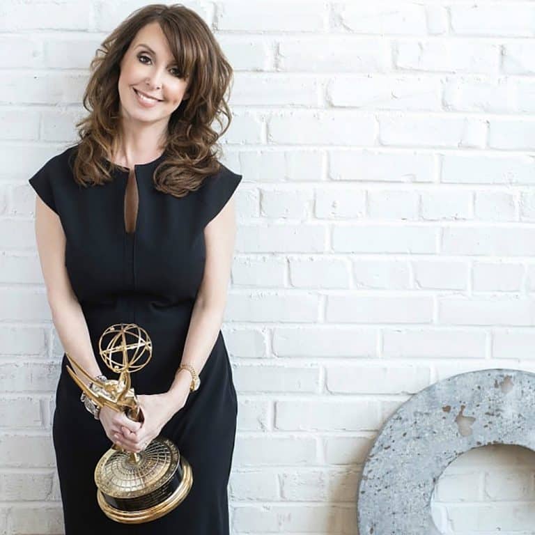 Talk Show Producer Donna Benner Holding Her Emmy Award